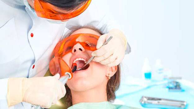 Dentist filling a child's tooth
